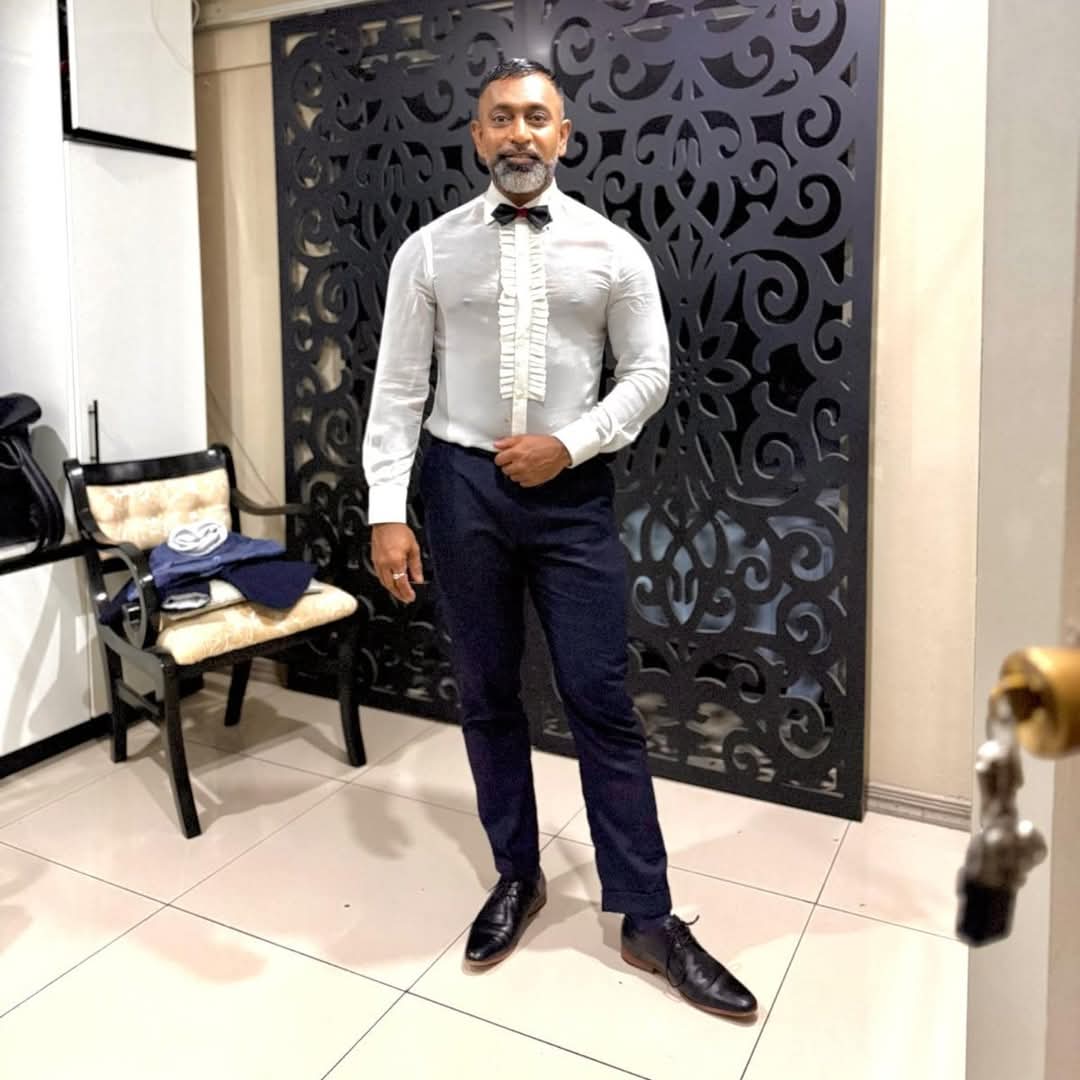 Bespoke formal shirt with bow tie and tailored navy trousers by Eleganza
