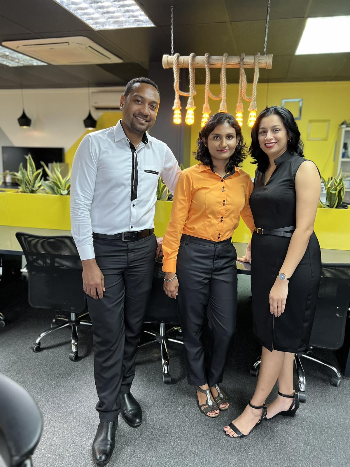 Eleganza team trio in mixed corporate uniforms at the Nadi atelier