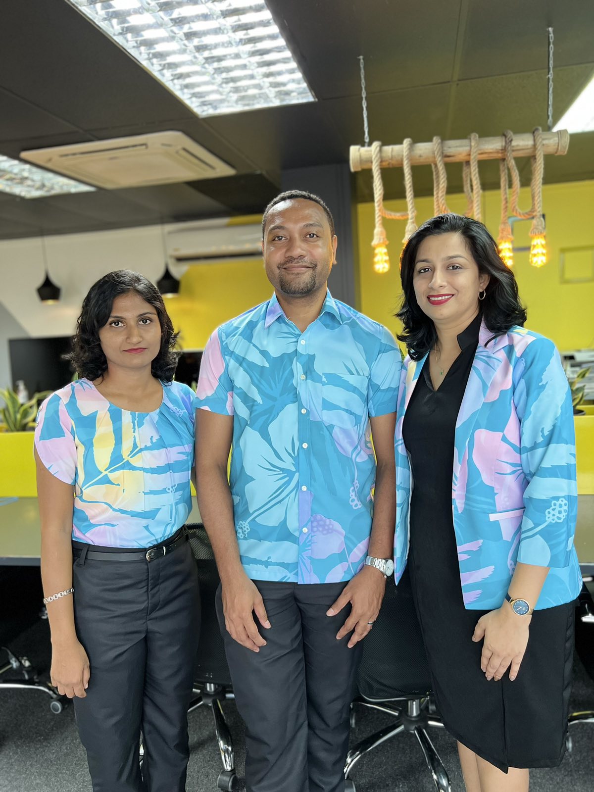 The Eleganza team wearing their own tailored Pacific-print uniforms at the Nadi atelier