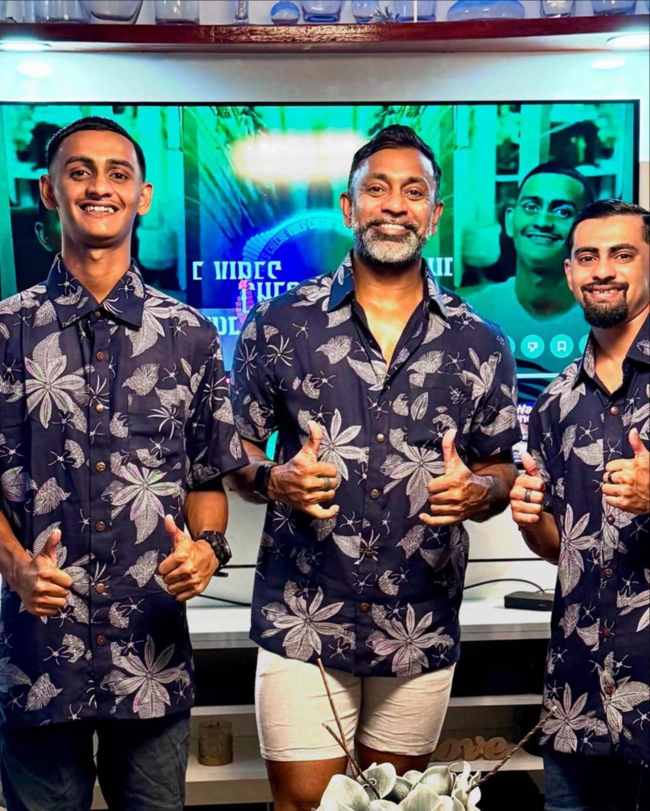 Matching navy floral aloha shirts for a corporate event